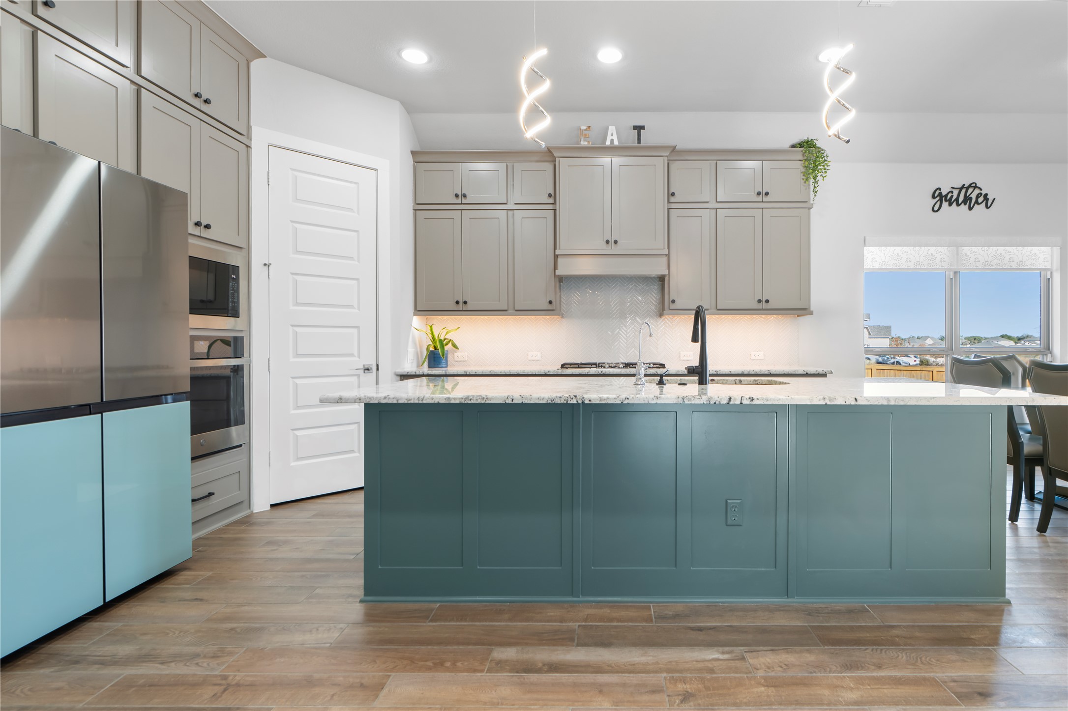 224 Grn Knl Lane Georgetown, TX 78628 - Photo 9 of 38 a kitchen with granite countertop a refrigerator and a sink