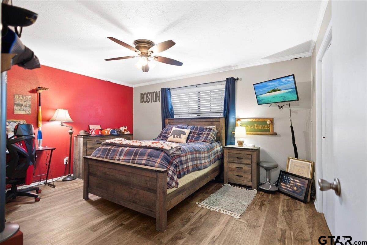 1606 Timothy Street Henderson, TX 75654 - Photo 19 of 33 a bed room with a bed and a window