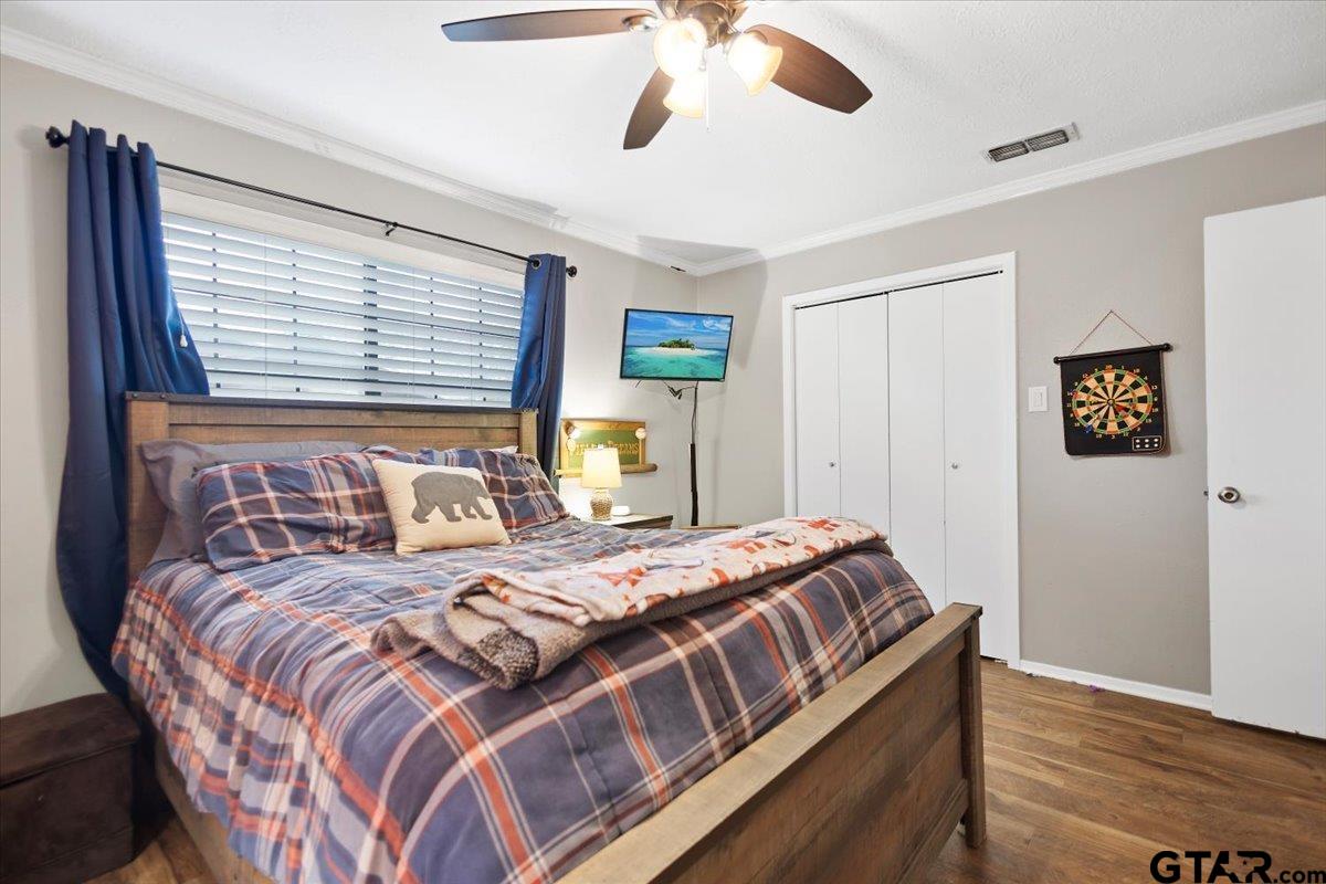 1606 Timothy Street Henderson, TX 75654 - Photo 20 of 33 a bedroom with a large bed and a window