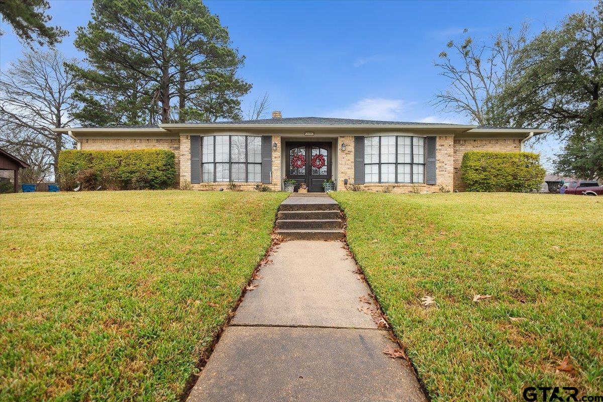 1606 Timothy Street Henderson, TX 75654 - Photo 2 of 33 a front view of a house with a yard