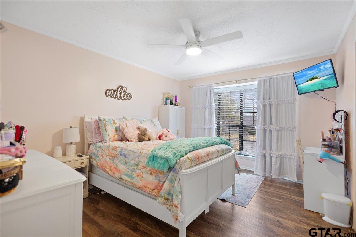 1606 Timothy Street Henderson, TX 75654 - Photo 22 of 33 a bed room with a bed and a couch