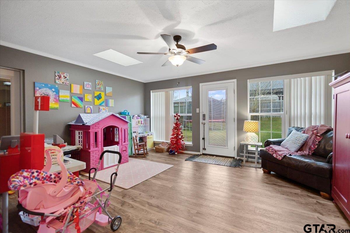 1606 Timothy Street Henderson, TX 75654 - Photo 28 of 33 a living room with furniture gym equipment and a large window