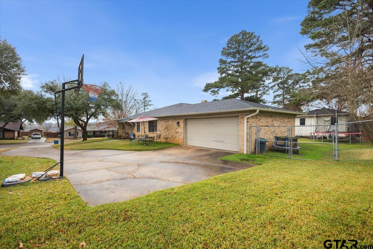 1606 Timothy Street Henderson, TX 75654 - Photo 31 of 33 a view of a yard in front of house