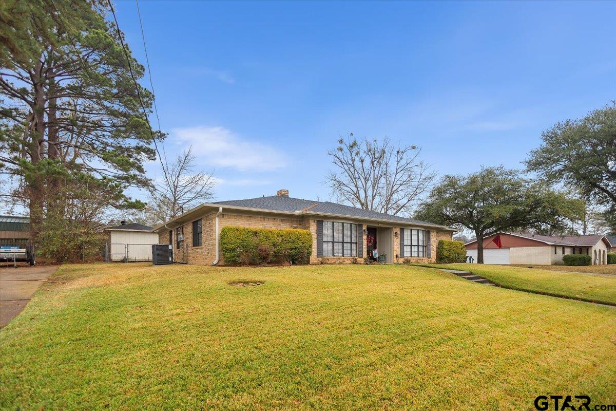 1606 Timothy Street Henderson, TX 75654 - Photo 32 of 33 a view of a house with a yard