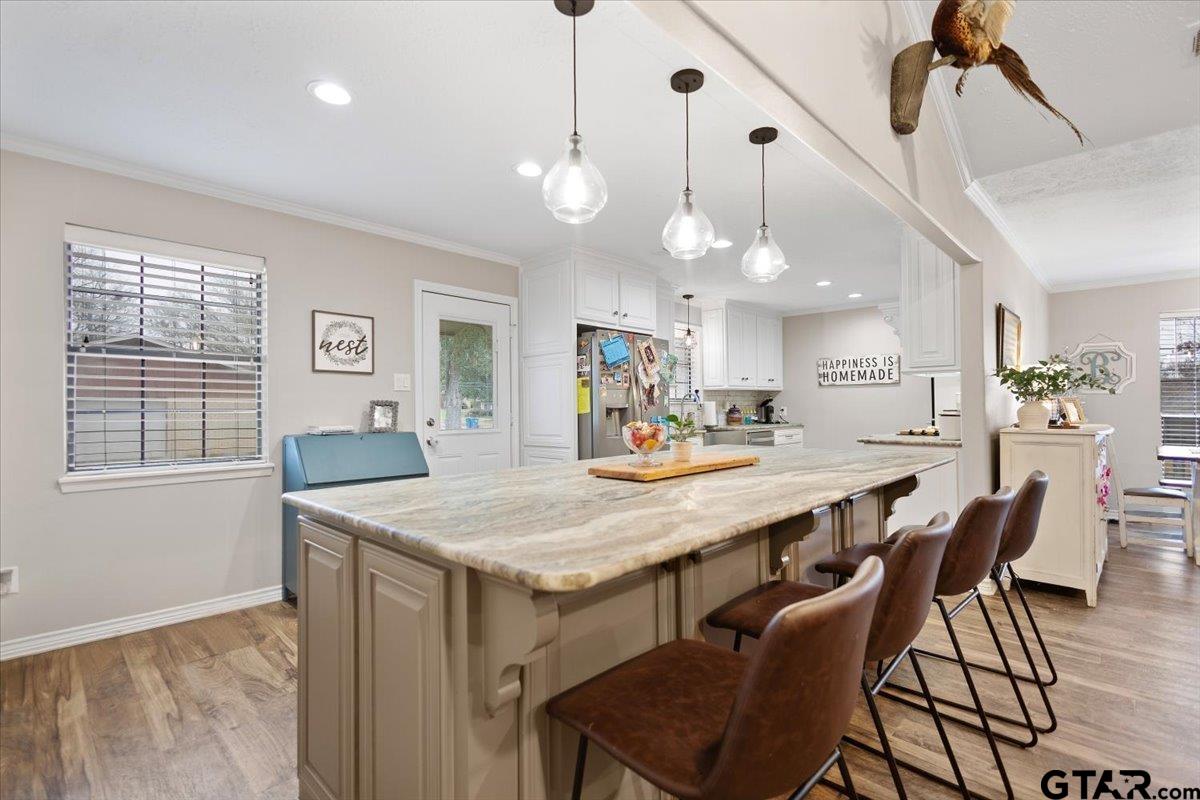 1606 Timothy Street Henderson, TX 75654 - Photo 6 of 33 a large kitchen with a table and chairs