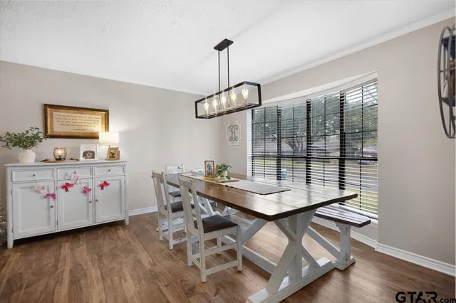 a view of a workspace with furniture and window