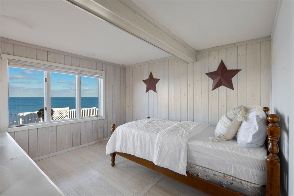 40 Cliff Road South Scituate, MA 02066 - Photo 12 of 30 a bedroom with a bed and a large window