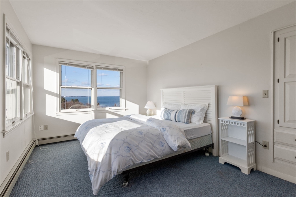 40 Cliff Road South Scituate, MA 02066 - Photo 15 of 30 a bed room with a bed and a large window