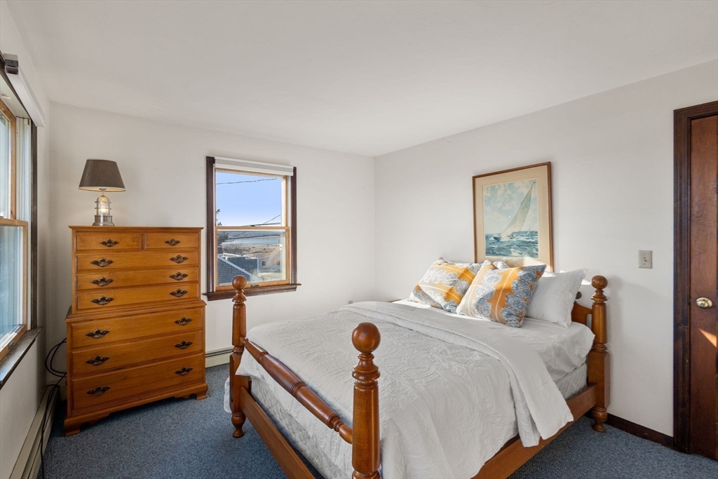 40 Cliff Road South Scituate, MA 02066 - Photo 17 of 30 a bedroom with a bed and a dresser