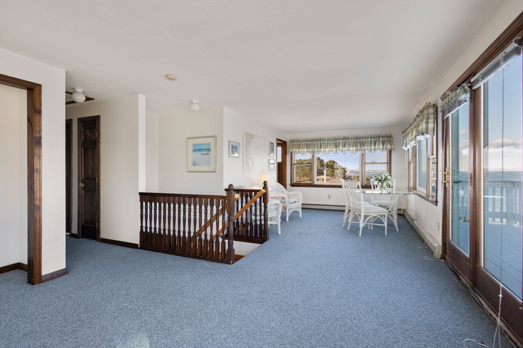 40 Cliff Road South Scituate, MA 02066 - Photo 20 of 30 a living room with furniture and a floor to ceiling window