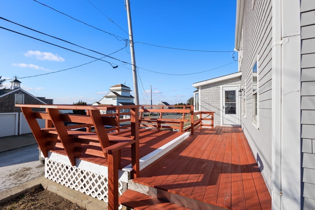 40 Cliff Road South Scituate, MA 02066 - Photo 27 of 30 a view of a chairs and table in the balcony