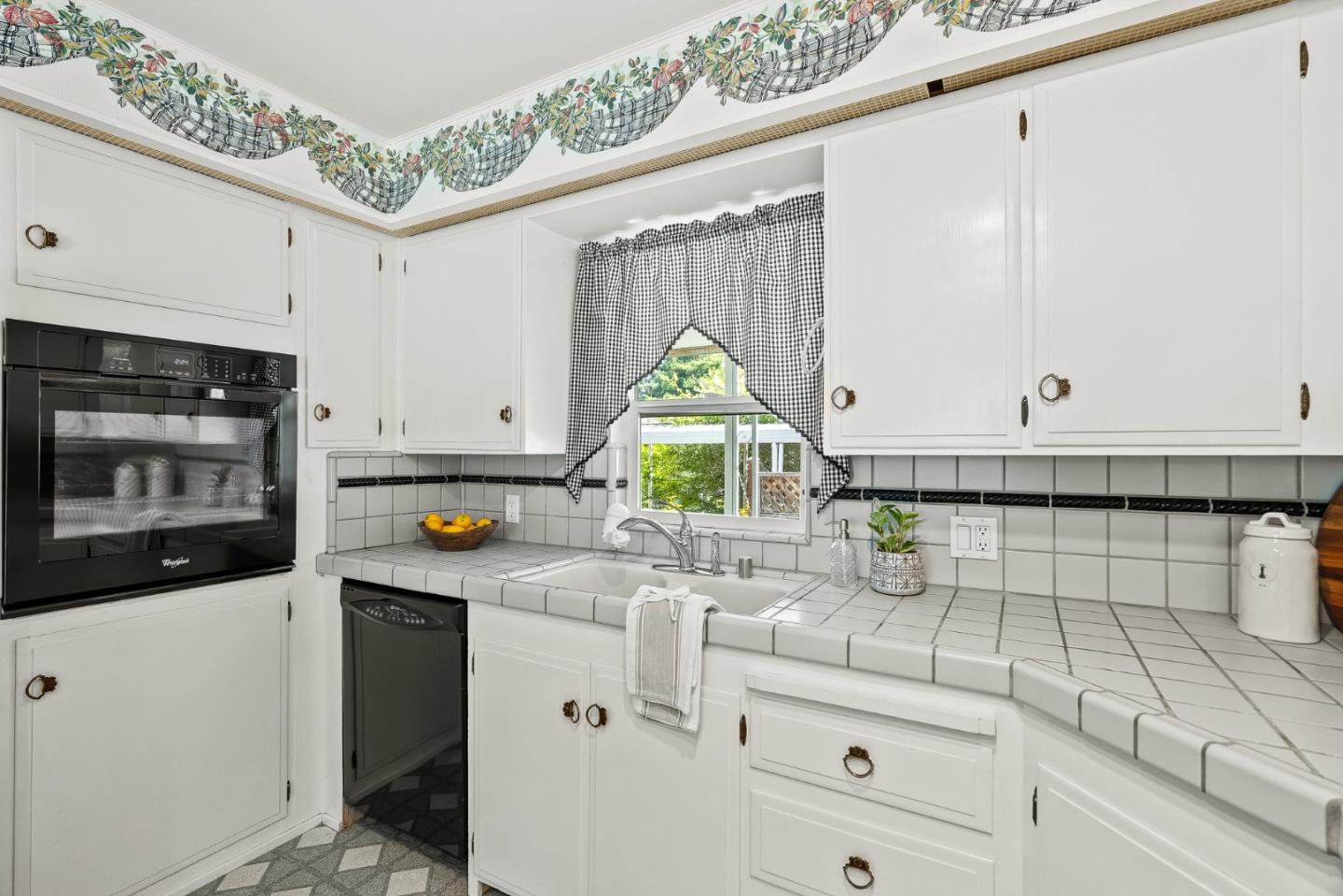15 Oak Shadows Lane, Unit 15 Aptos, CA 95003 - Photo 11 of 56 a kitchen with stainless steel appliances a sink stove and cabinets