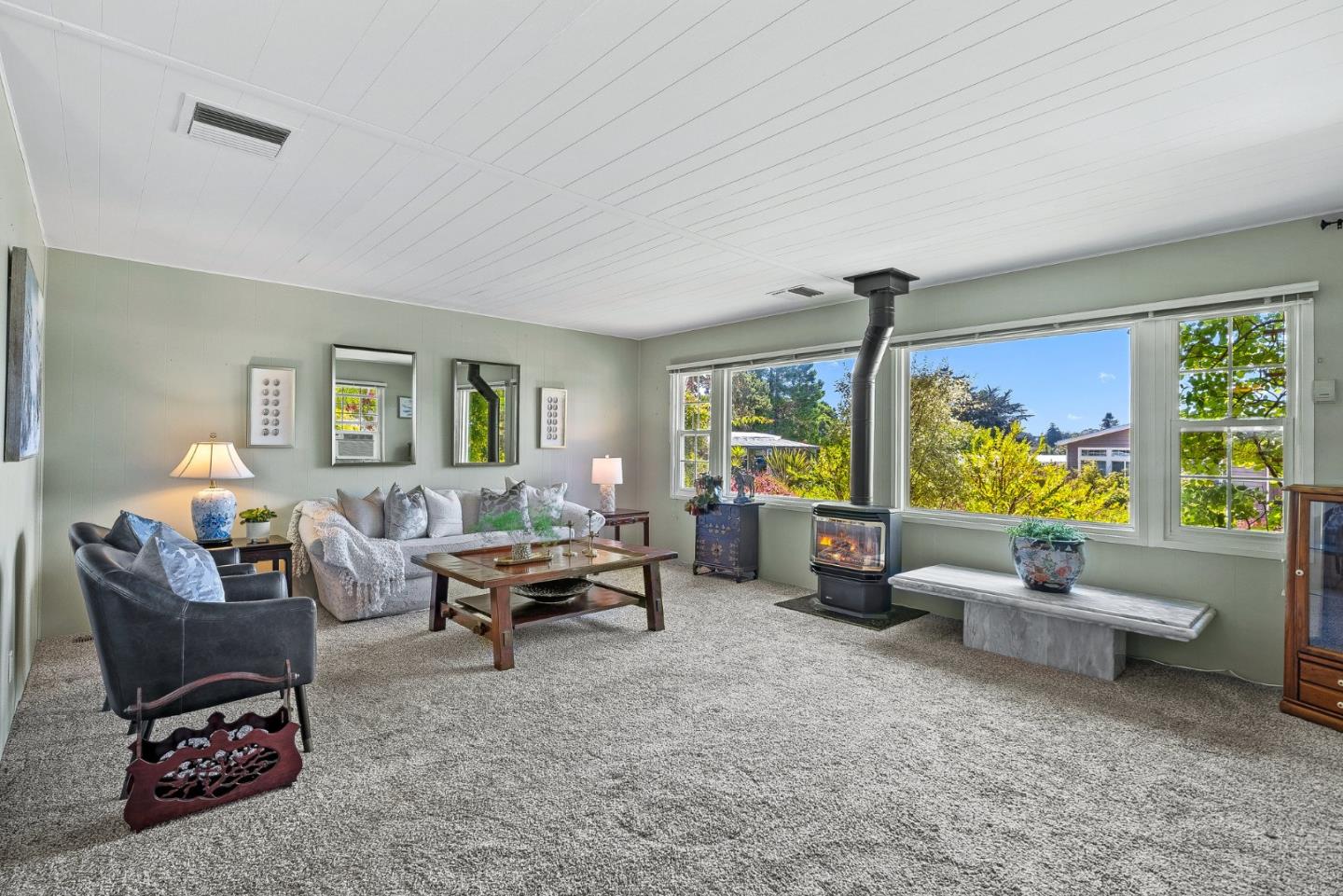 15 Oak Shadows Lane, Unit 15 Aptos, CA 95003 - Photo 2 of 56 a living room with furniture and a large window