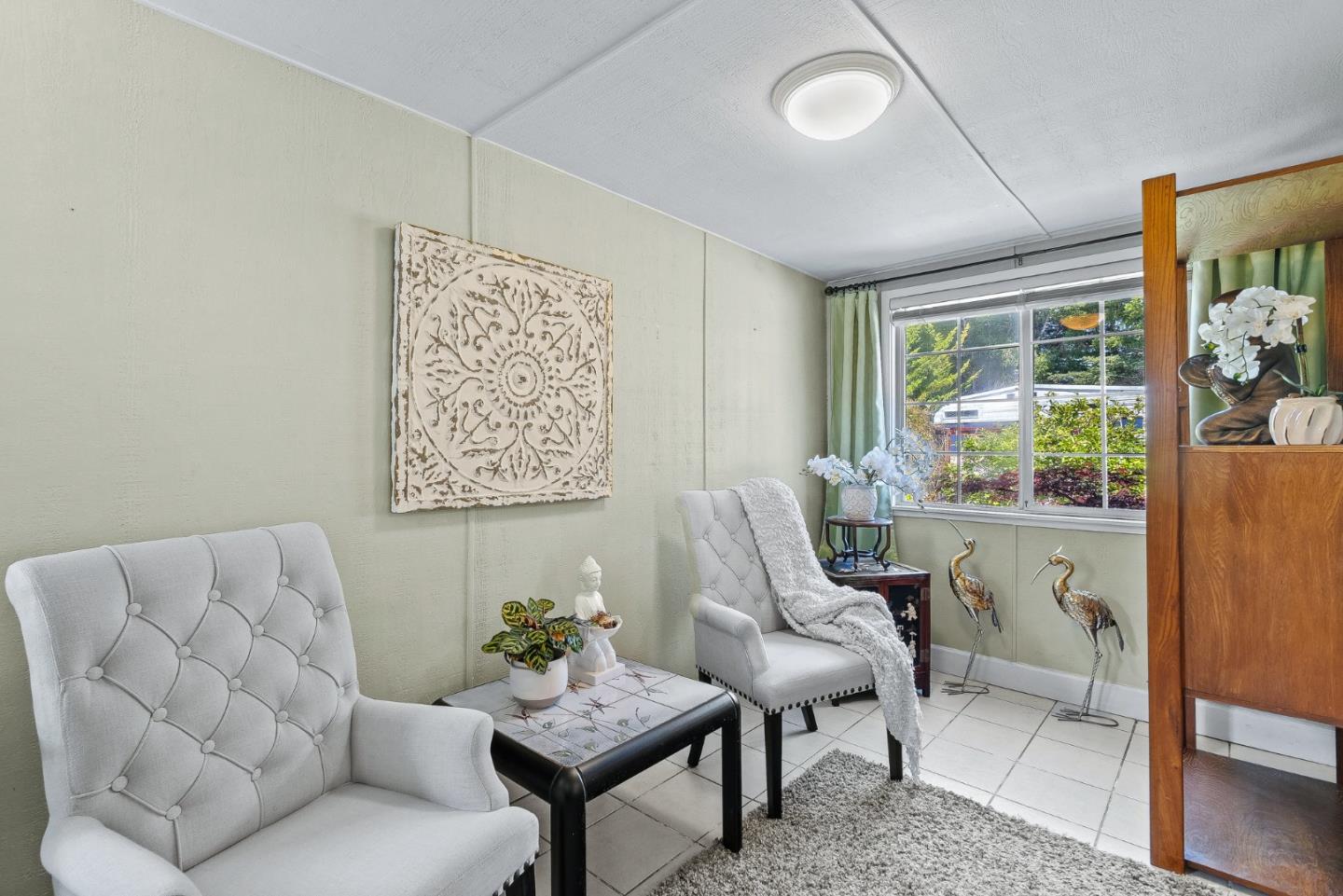 15 Oak Shadows Lane, Unit 15 Aptos, CA 95003 - Photo 21 of 56 a living room with furniture and a large window