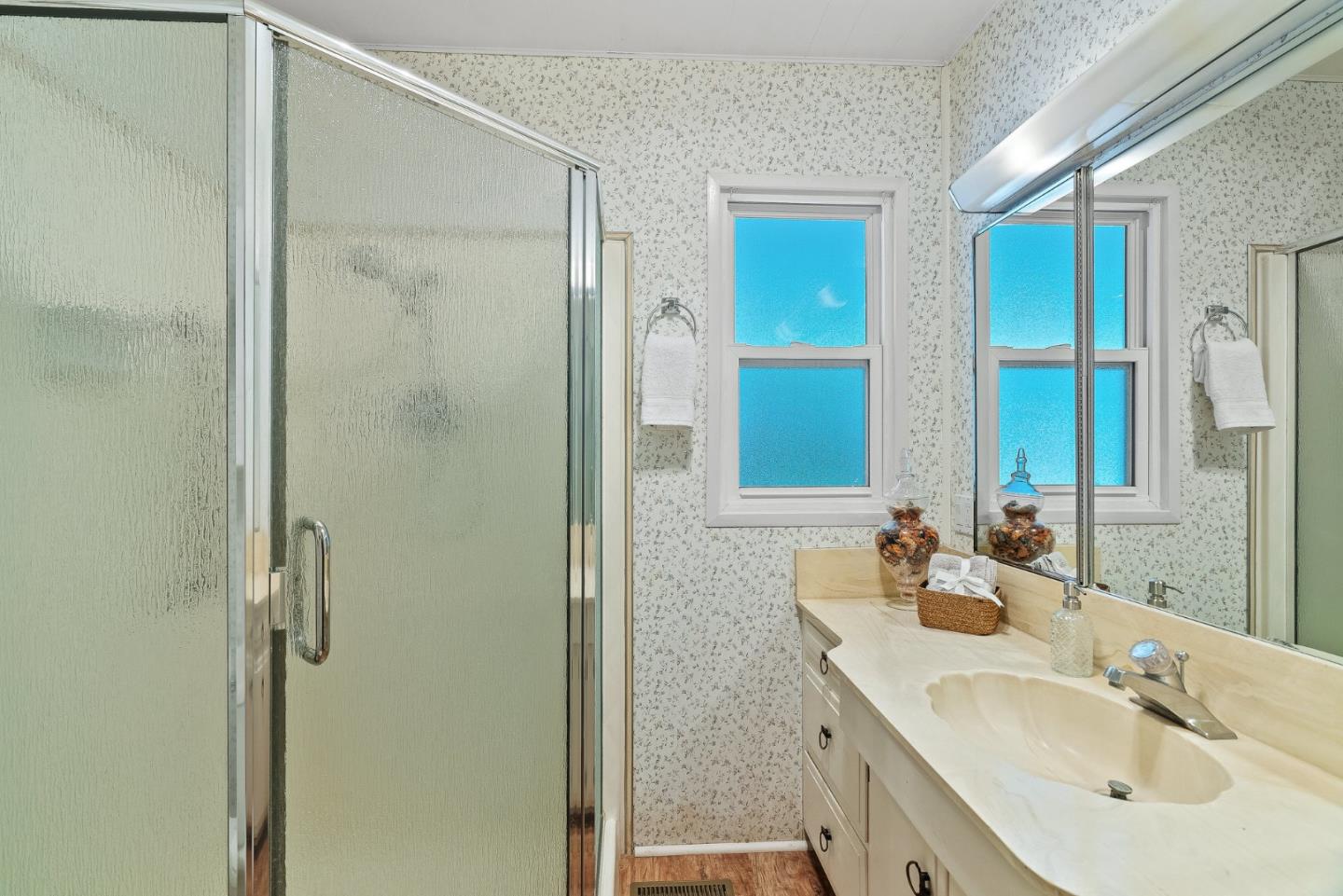 15 Oak Shadows Lane, Unit 15 Aptos, CA 95003 - Photo 22 of 56 a bathroom with a double vanity sink mirror and shower