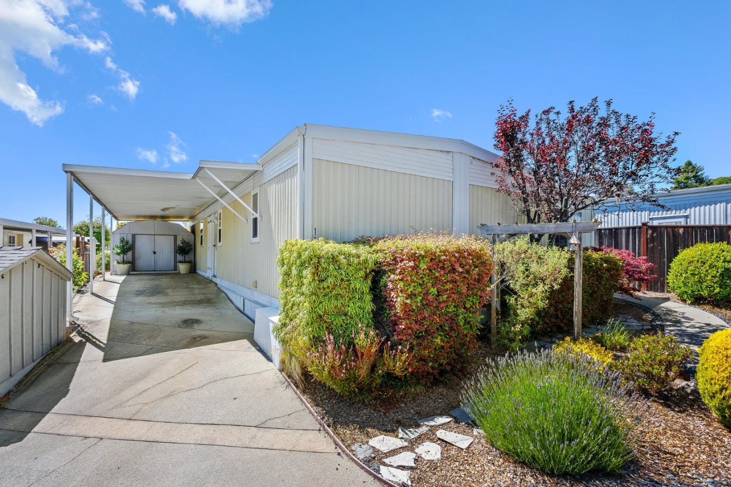 15 Oak Shadows Lane, Unit 15 Aptos, CA 95003 - Photo 28 of 56 a front view of a house with a garden