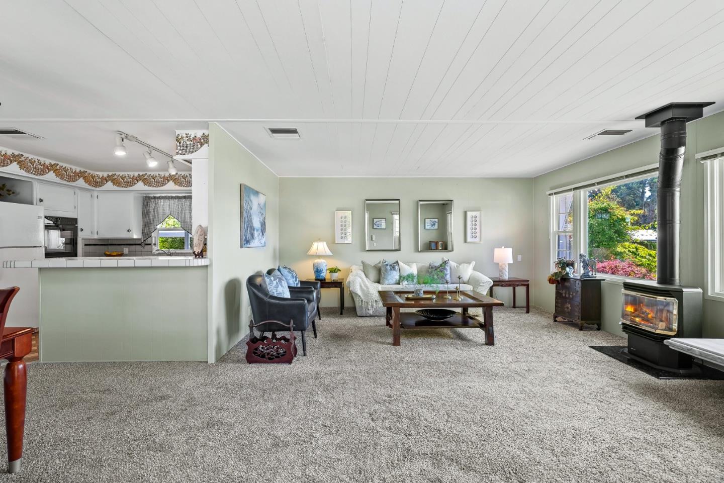 15 Oak Shadows Lane, Unit 15 Aptos, CA 95003 - Photo 3 of 56 a living room with furniture and a flat screen tv