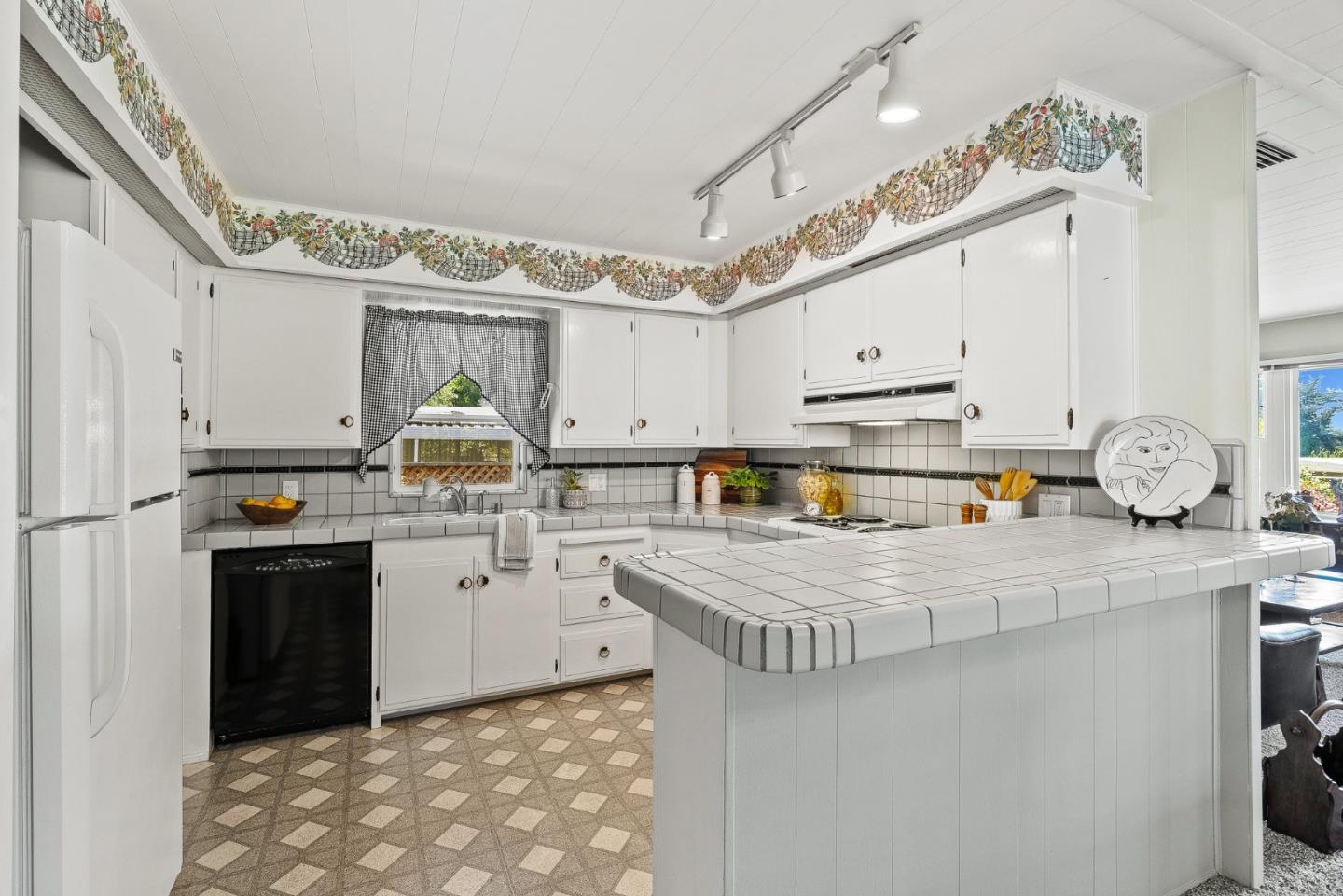 15 Oak Shadows Lane, Unit 15 Aptos, CA 95003 - Photo 9 of 56 a kitchen with stainless steel appliances granite countertop a stove a sink dishwasher and a refrigerator
