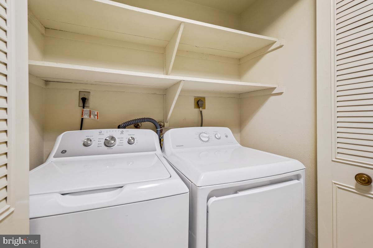 3362 Gleneagles Drive, Unit 711D Silver Spring, MD 20906 - Photo 20 of 26 Side-by-side Washer Dryer in the unit.
