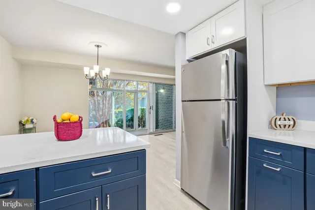 a kitchen with refrigerator a stove a sink and a refrigerator