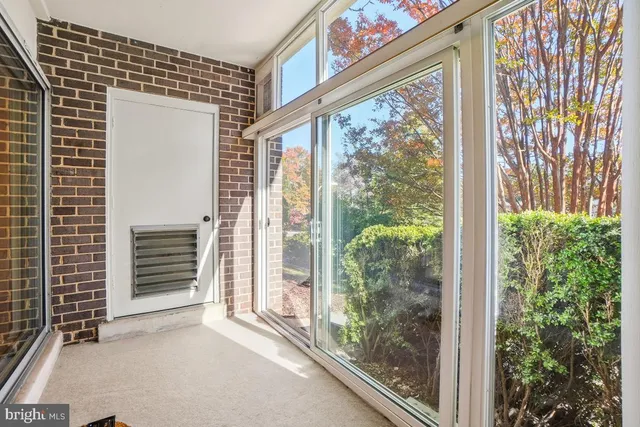 a view of a room that has a large window