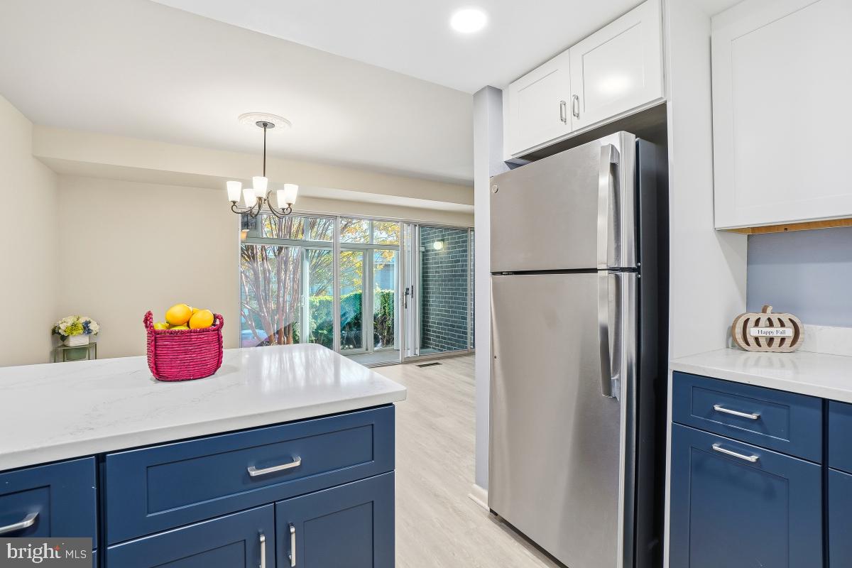 3362 Gleneagles Drive, Unit 711D Silver Spring, MD 20906 - Photo 8 of 26 a kitchen with refrigerator a stove a sink and a refrigerator