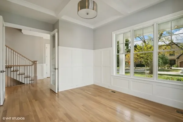 a view of an entryway with wooden floor