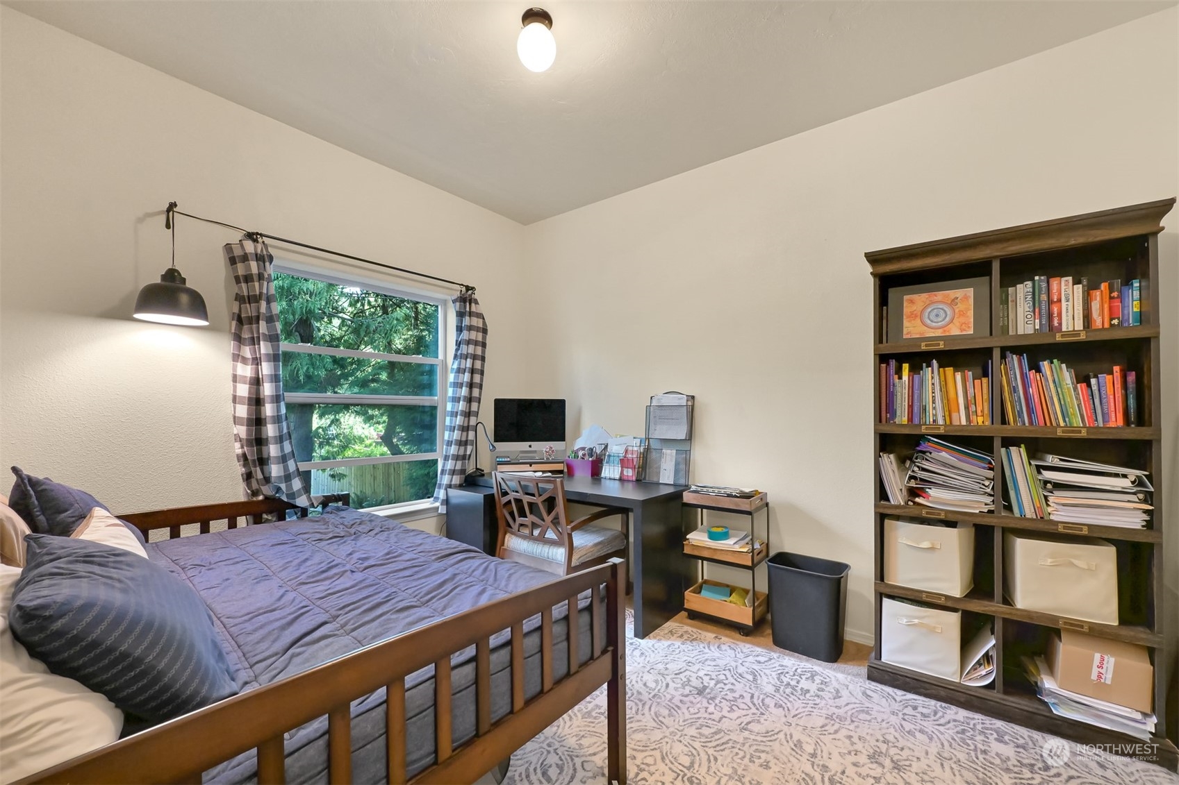 4298 Masterson Road Blaine, WA 98230 - Photo 14 of 31 a bedroom with a bed a book shelf and a window