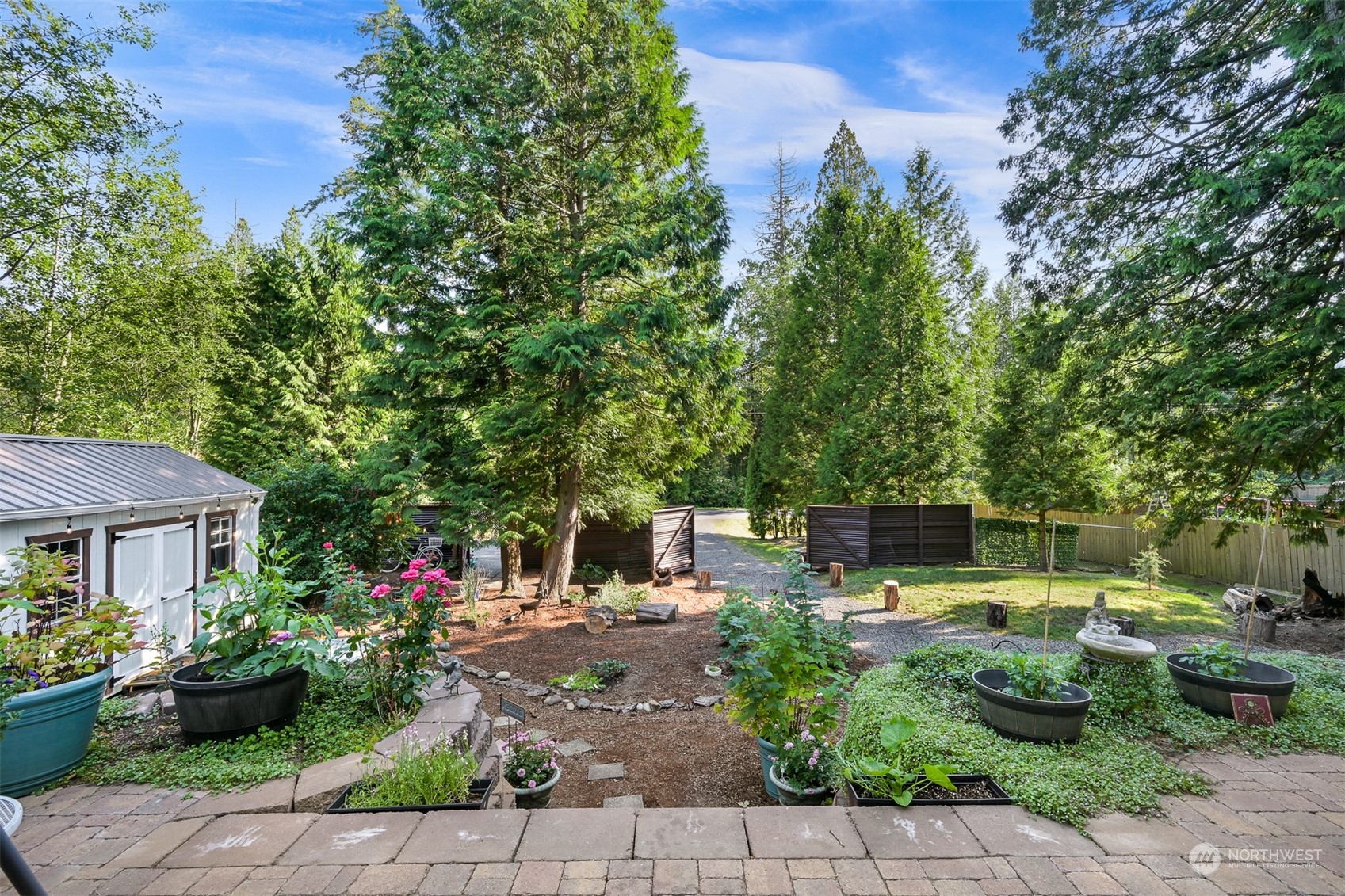 4298 Masterson Road Blaine, WA 98230 - Photo 17 of 31 a view of a patio with furniture and a garden