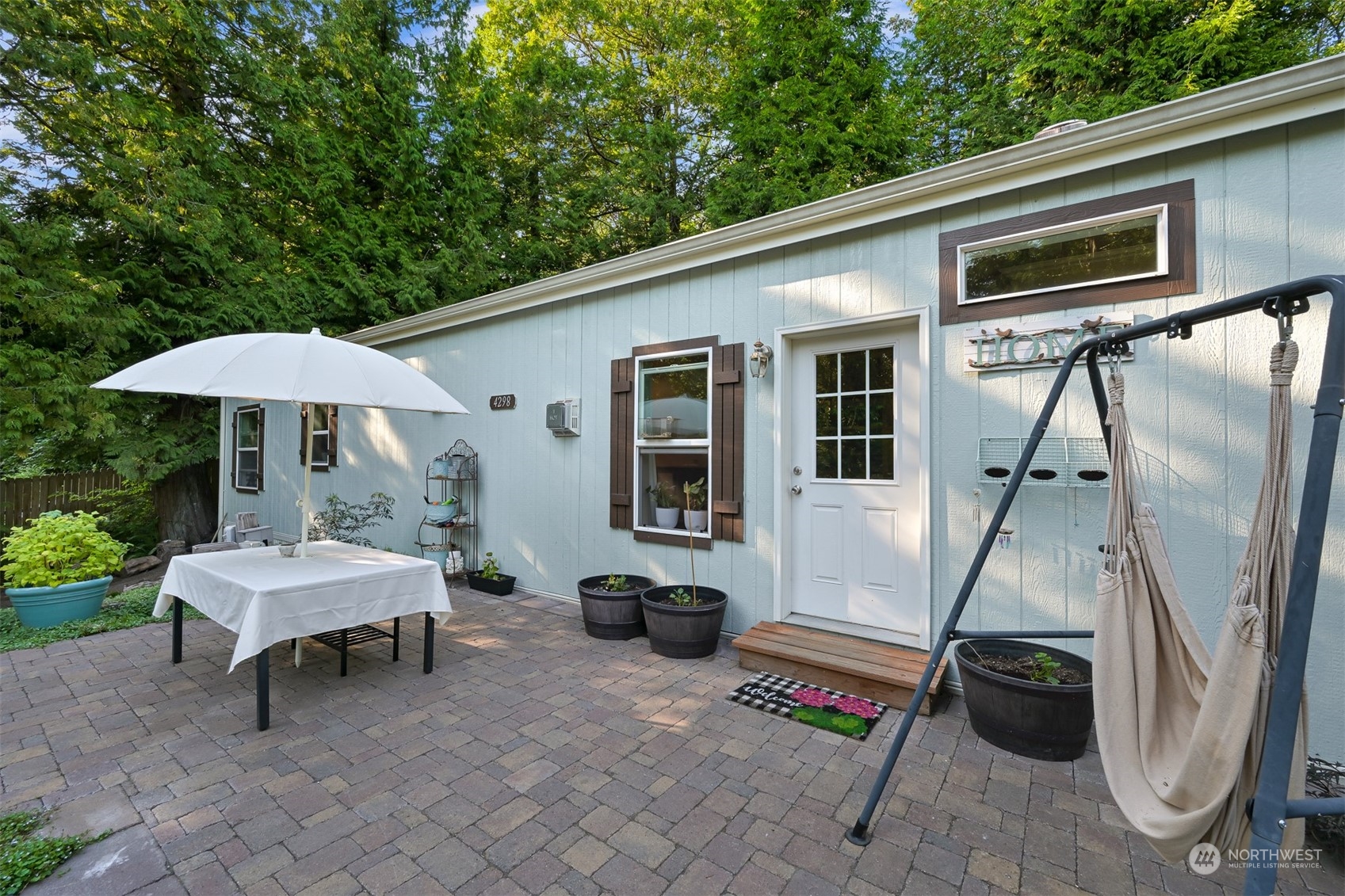 4298 Masterson Road Blaine, WA 98230 - Photo 2 of 31 a backyard of a house with barbeque oven table and chairs