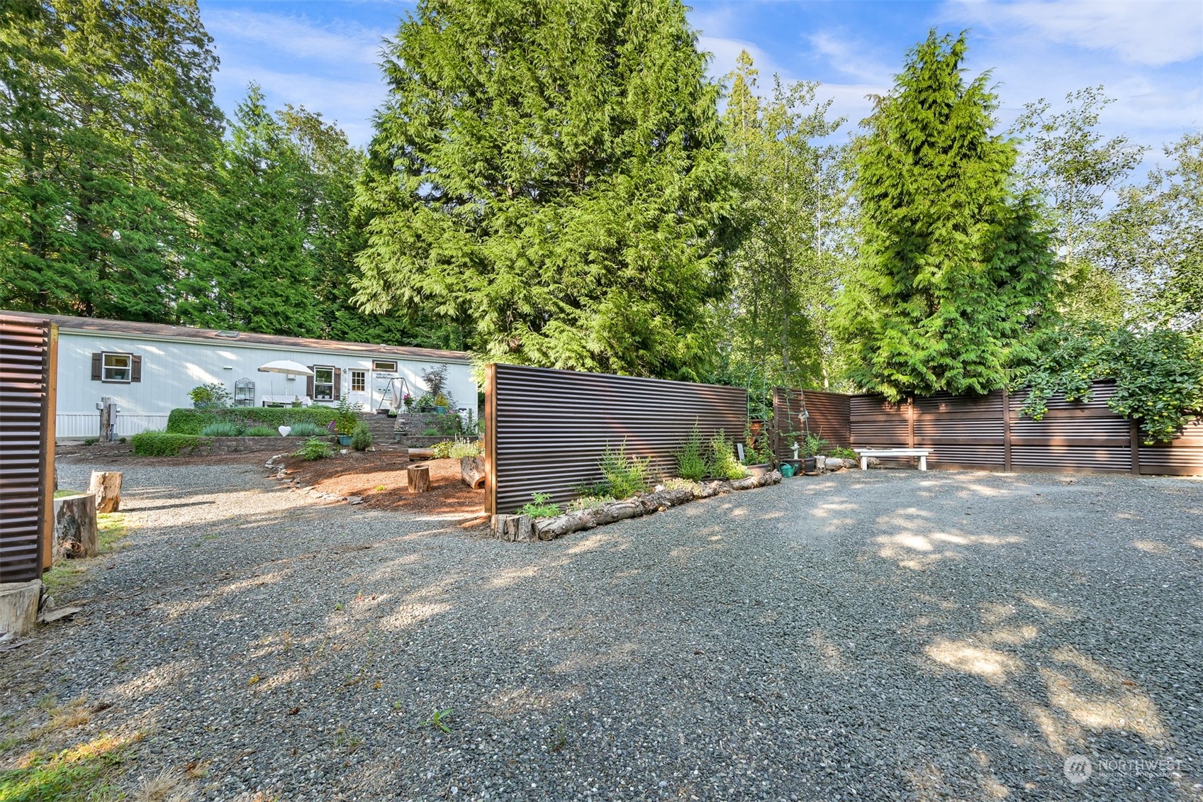 4298 Masterson Road Blaine, WA 98230 - Photo 24 of 31 a view of a street with some trees in the background