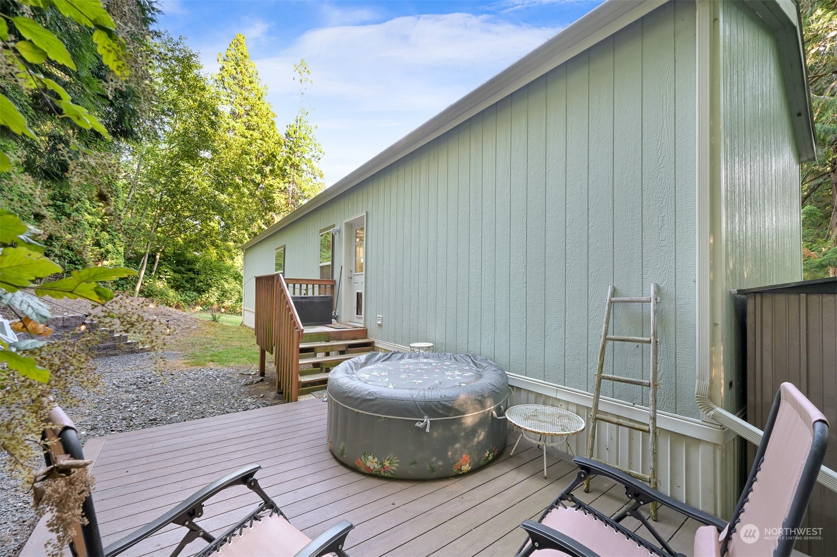4298 Masterson Road Blaine, WA 98230 - Photo 28 of 31 a backyard of a house with table and chairs
