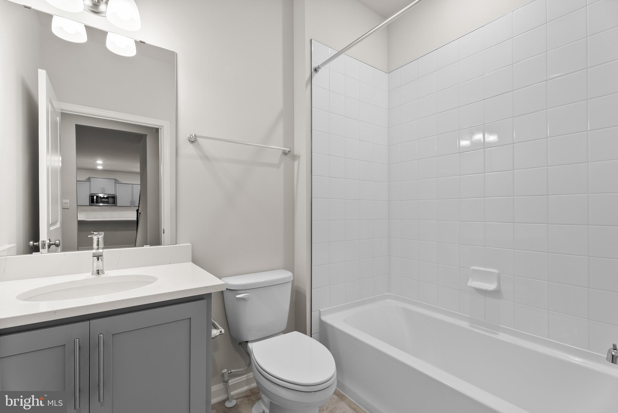 5 Comes Rdg Court Rosedale, MD 21237 - Photo 12 of 48 a bathroom with a sink a toilet and shower