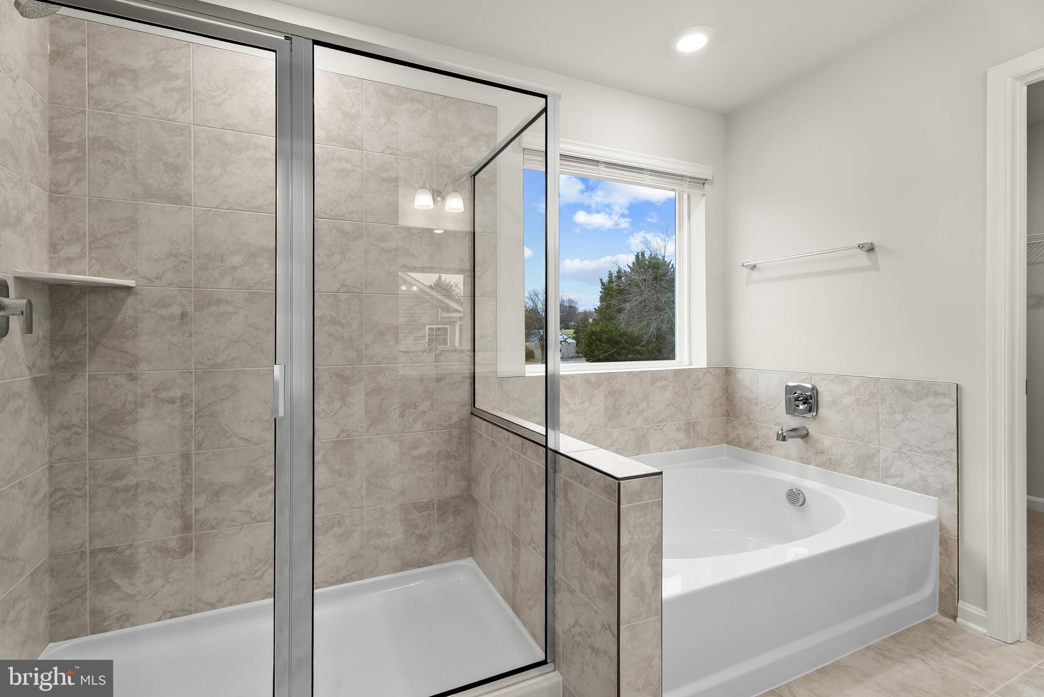 5 Comes Rdg Court Rosedale, MD 21237 - Photo 20 of 48 a bathroom with a bathtub and shower