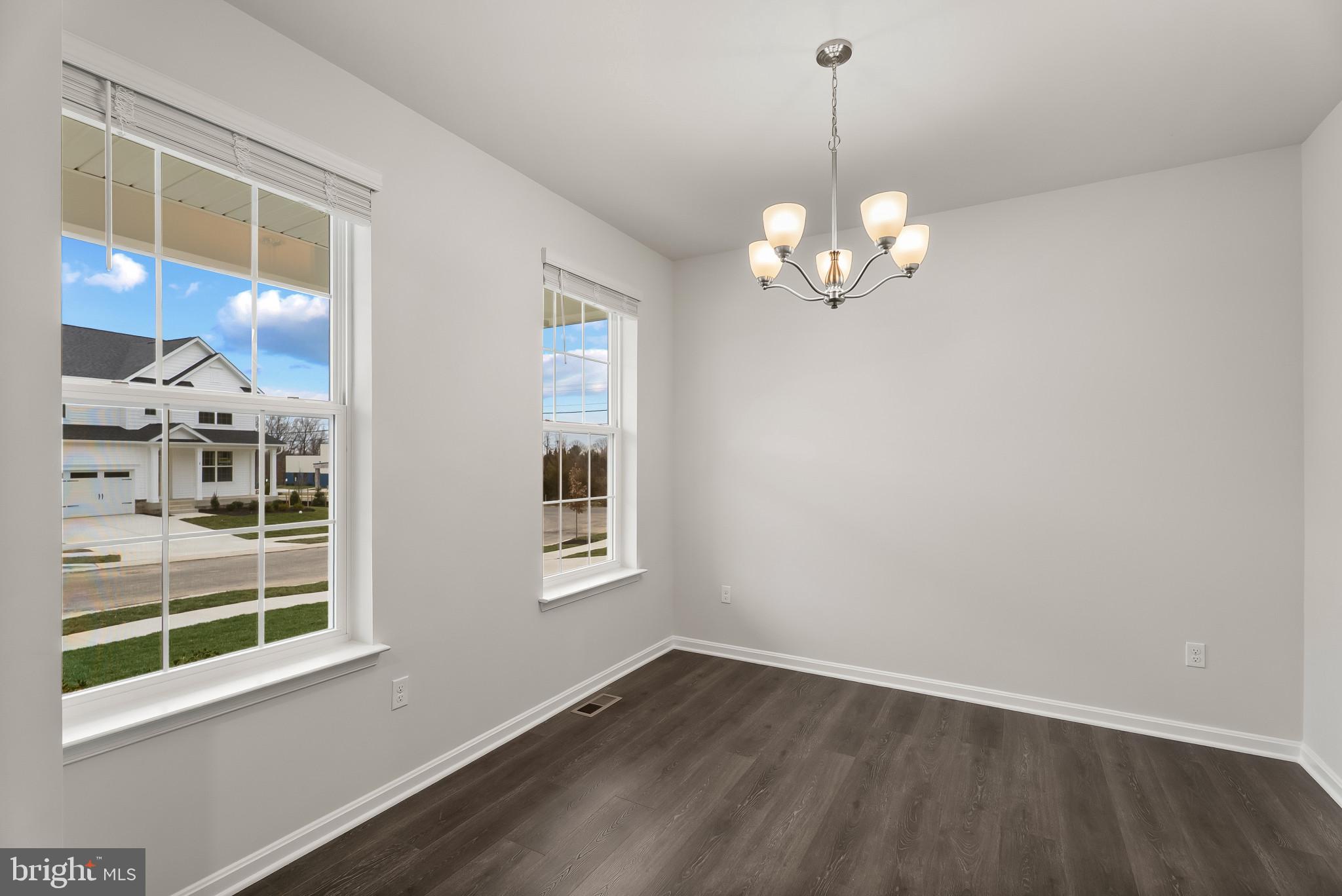 5 Comes Rdg Court Rosedale, MD 21237 - Photo 3 of 48 a view of a room with wooden floor and windows