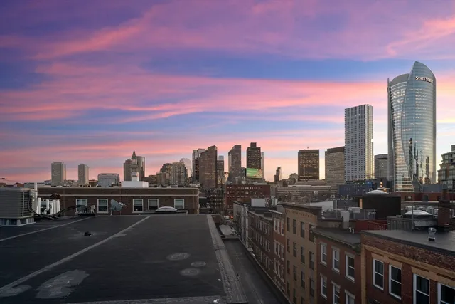 a view of city with a tall building
