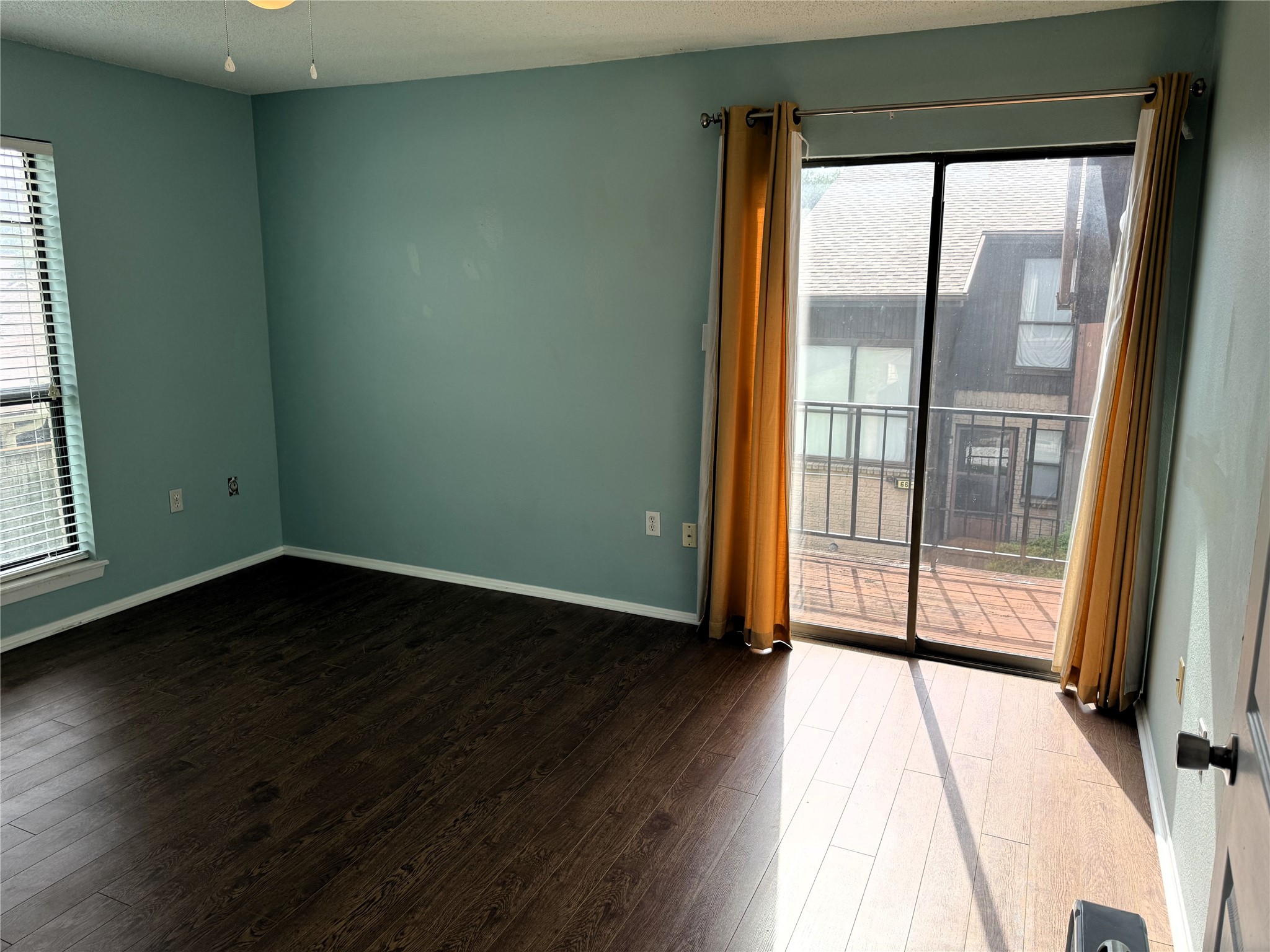 62 Evanston Street, Unit 2/5 Houston, TX 77015 - Photo 11 of 24 an empty room with wooden floor and windows