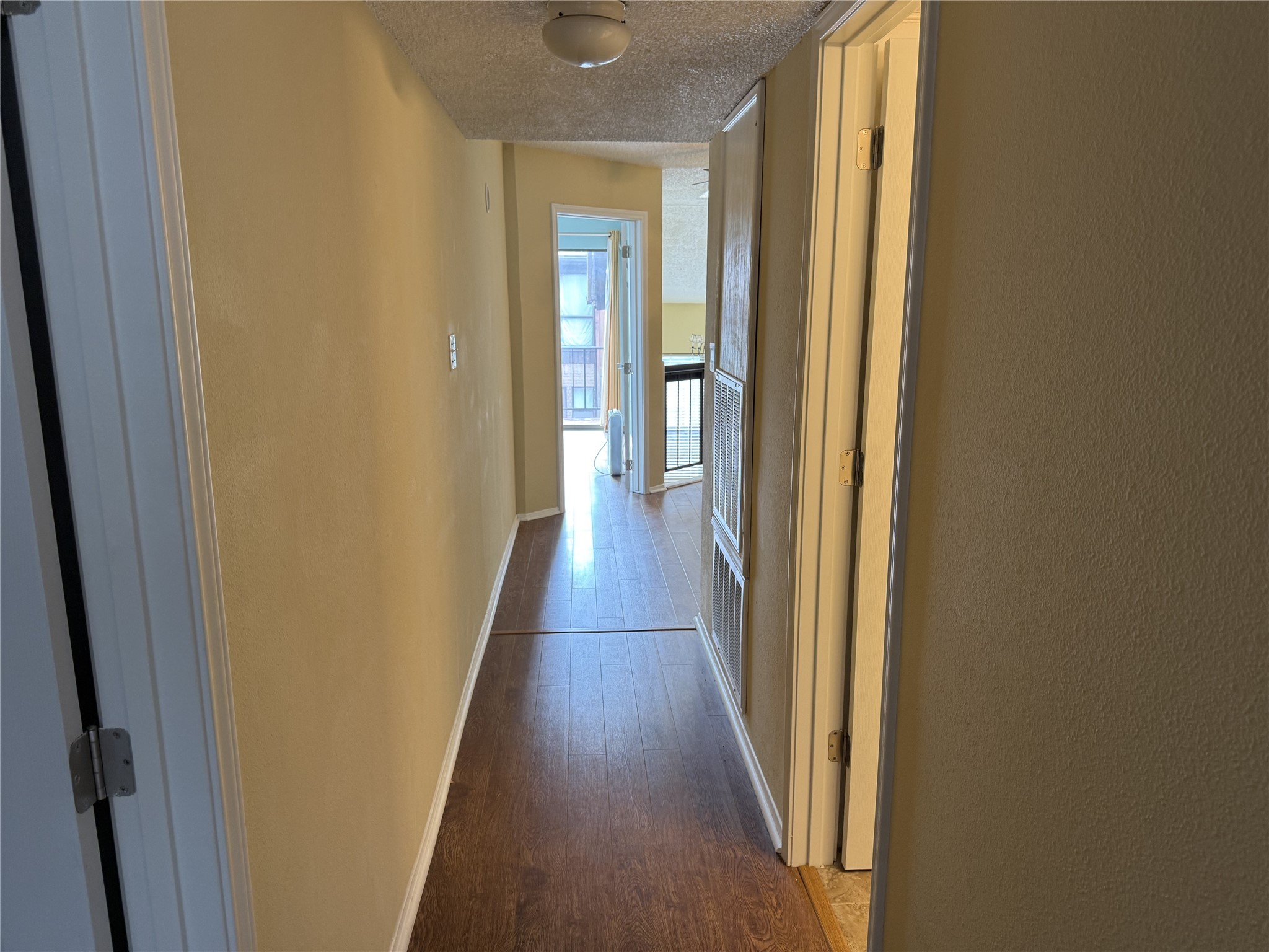 62 Evanston Street, Unit 2/5 Houston, TX 77015 - Photo 24 of 24 a view of a hallway with wooden floor and staircase