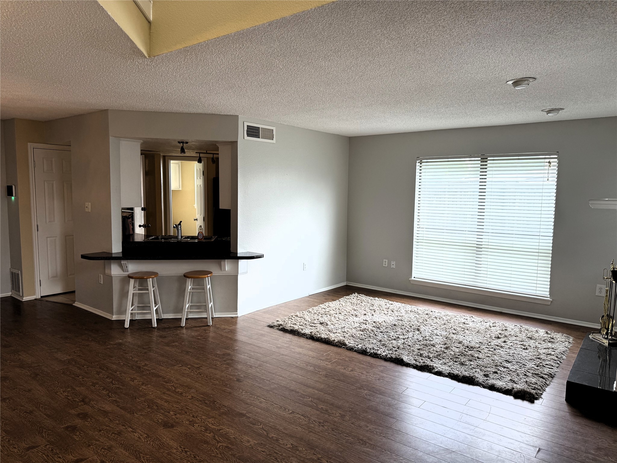 62 Evanston Street, Unit 2/5 Houston, TX 77015 - Photo 8 of 24 a living room with hard wood floors and a window