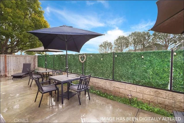 a patio with table and chairs