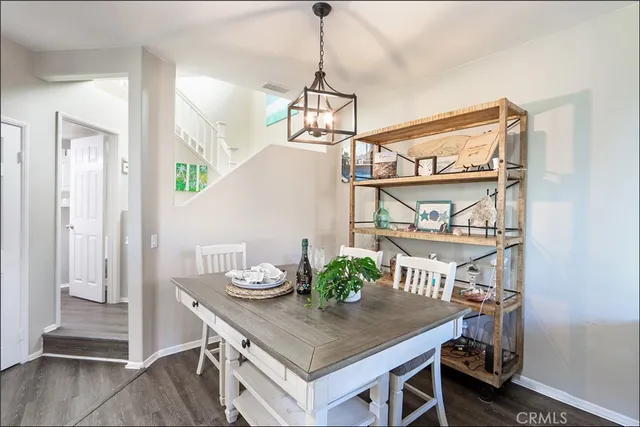 a room with a table and chairs