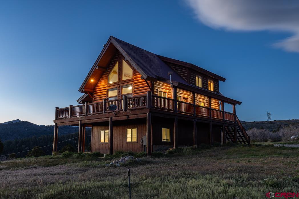 1737 Roberts Ridge Drive Hesperus, CO 81326 - Photo 28 of 34 a view of house with a yard