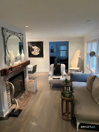 a living room with furniture a couch and a fireplace