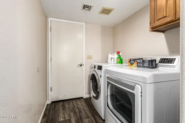 a utility room with dryer and washer