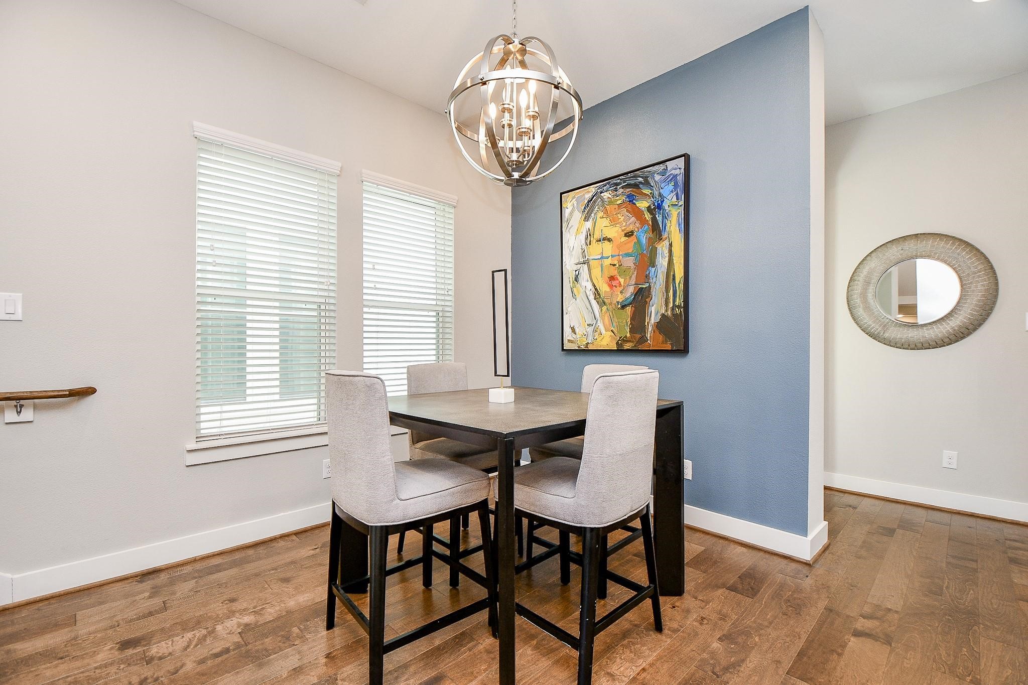 2010 St Charles Street Houston, TX 77003 - Photo 14 of 44 a view of a dining room with furniture window and wooden floor
