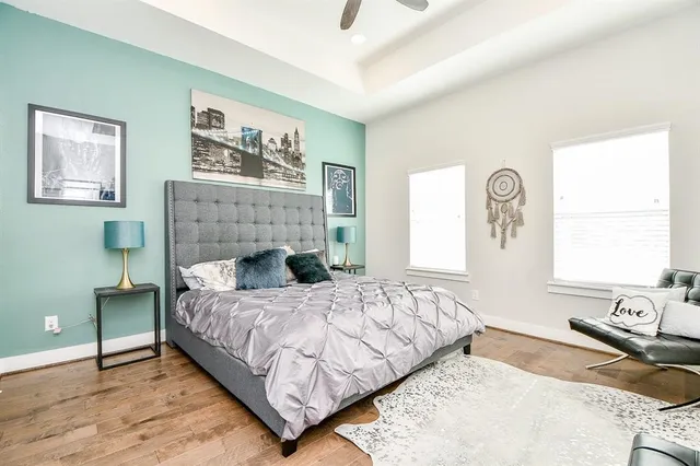 a bedroom with a bed and a couch