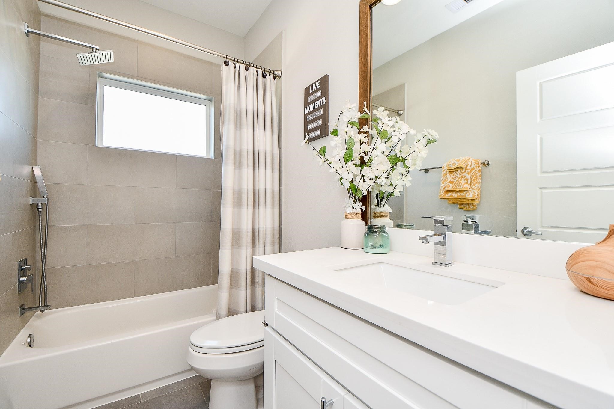 2010 St Charles Street Houston, TX 77003 - Photo 19 of 44 a bathroom with a sink a toilet and shower