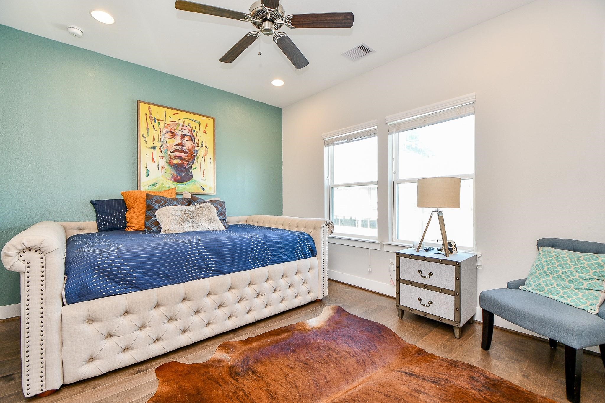 2010 St Charles Street Houston, TX 77003 - Photo 22 of 44 a bedroom with furniture and window