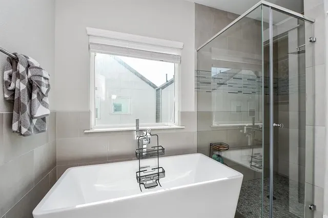 a view of an entryway with wooden floor and a window