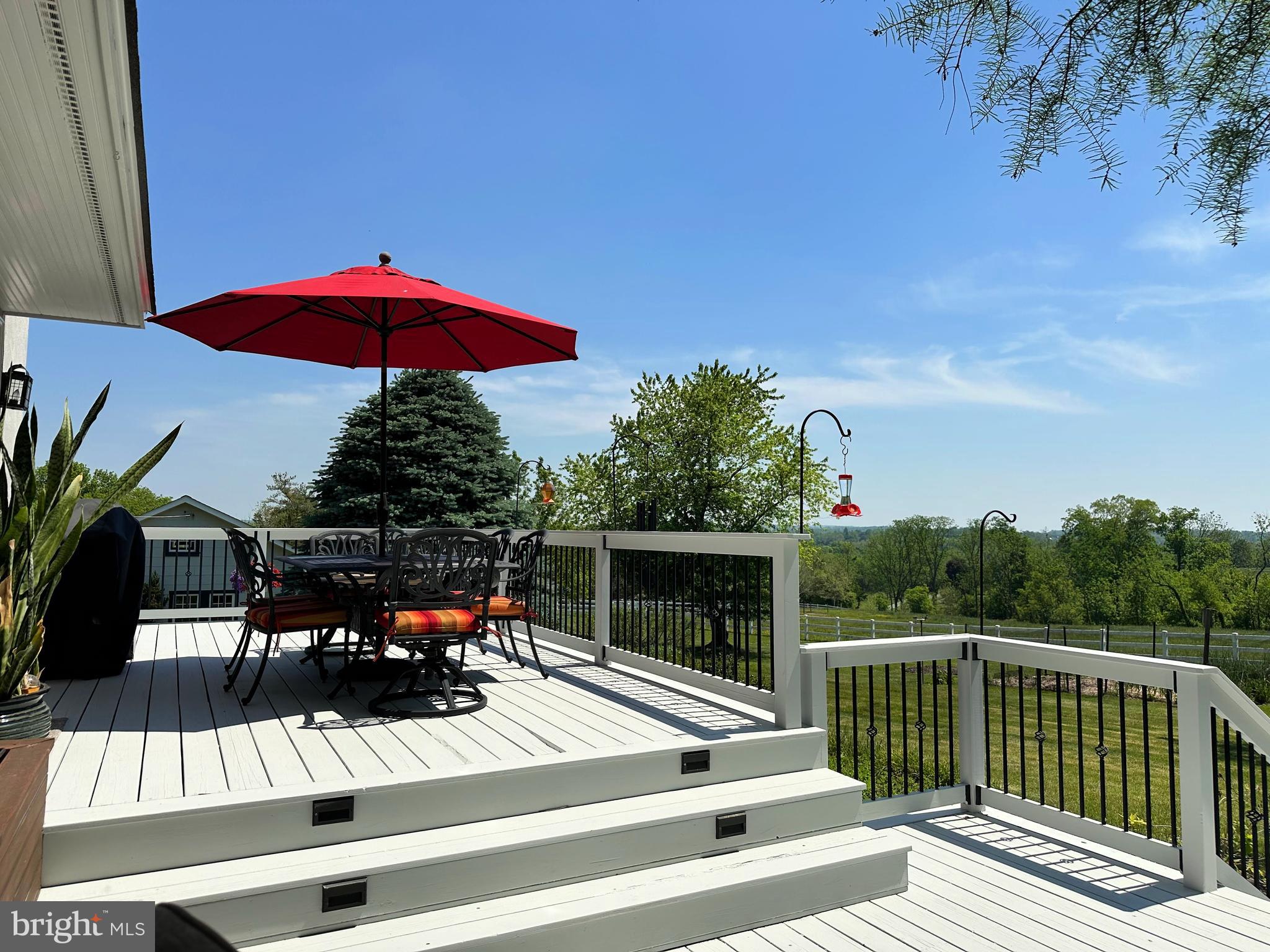 2382 Bergey Road Harleysville, PA 19438 - Photo 10 of 52 a view of a patio with a table and chairs under an umbrella